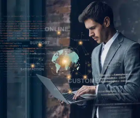 A businessman checking something in his laptop